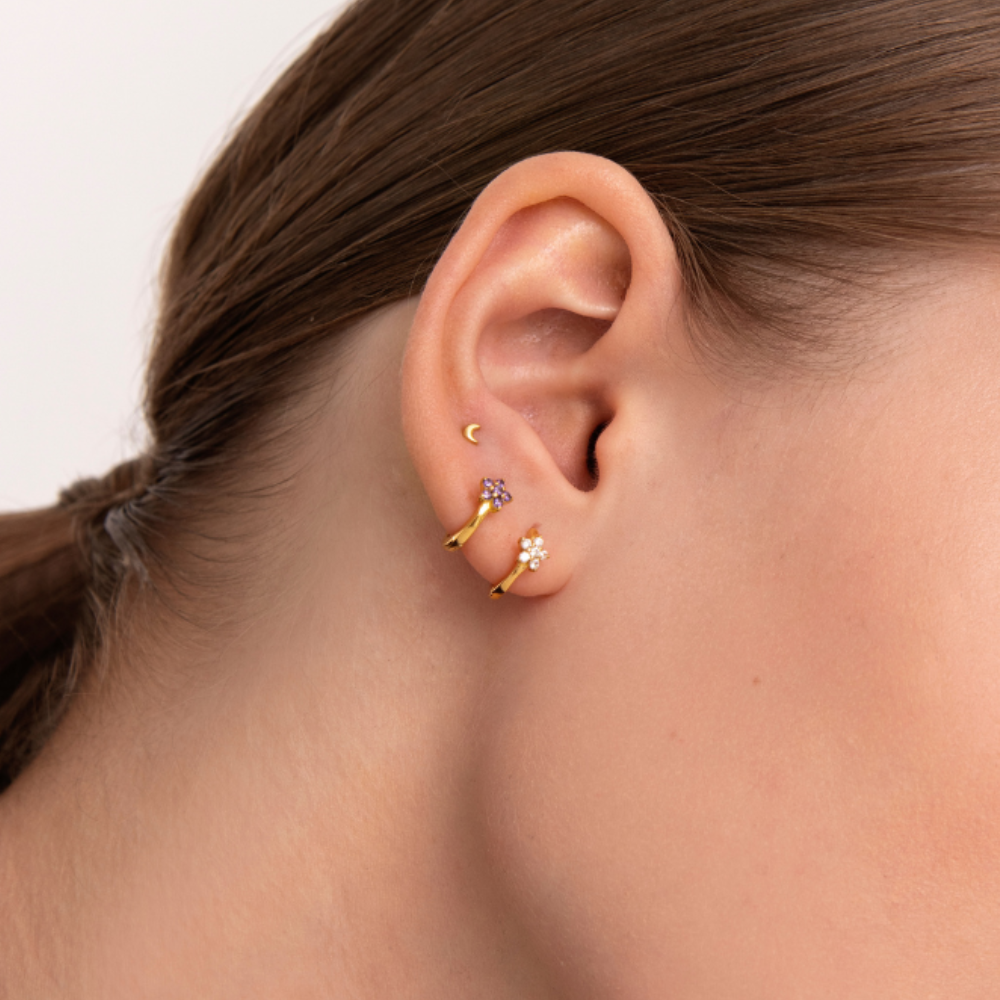 Women's Earring Featuring an Embedded Star Design and Round Stone Setting
