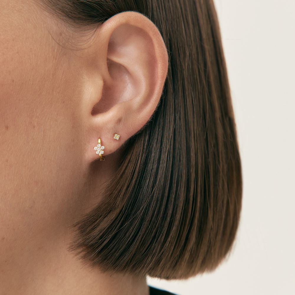 Women's Earring Featuring an Embedded Star Design and Round Stone Setting