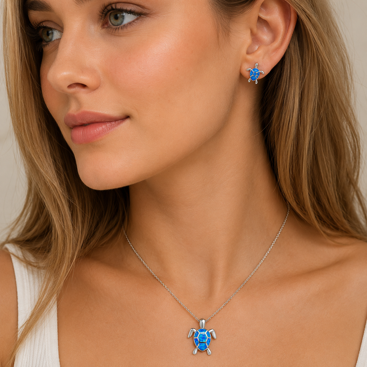 Kailea – Silver-tone turtle jewelry set featuring shimmering stone accents (necklace + earrings)