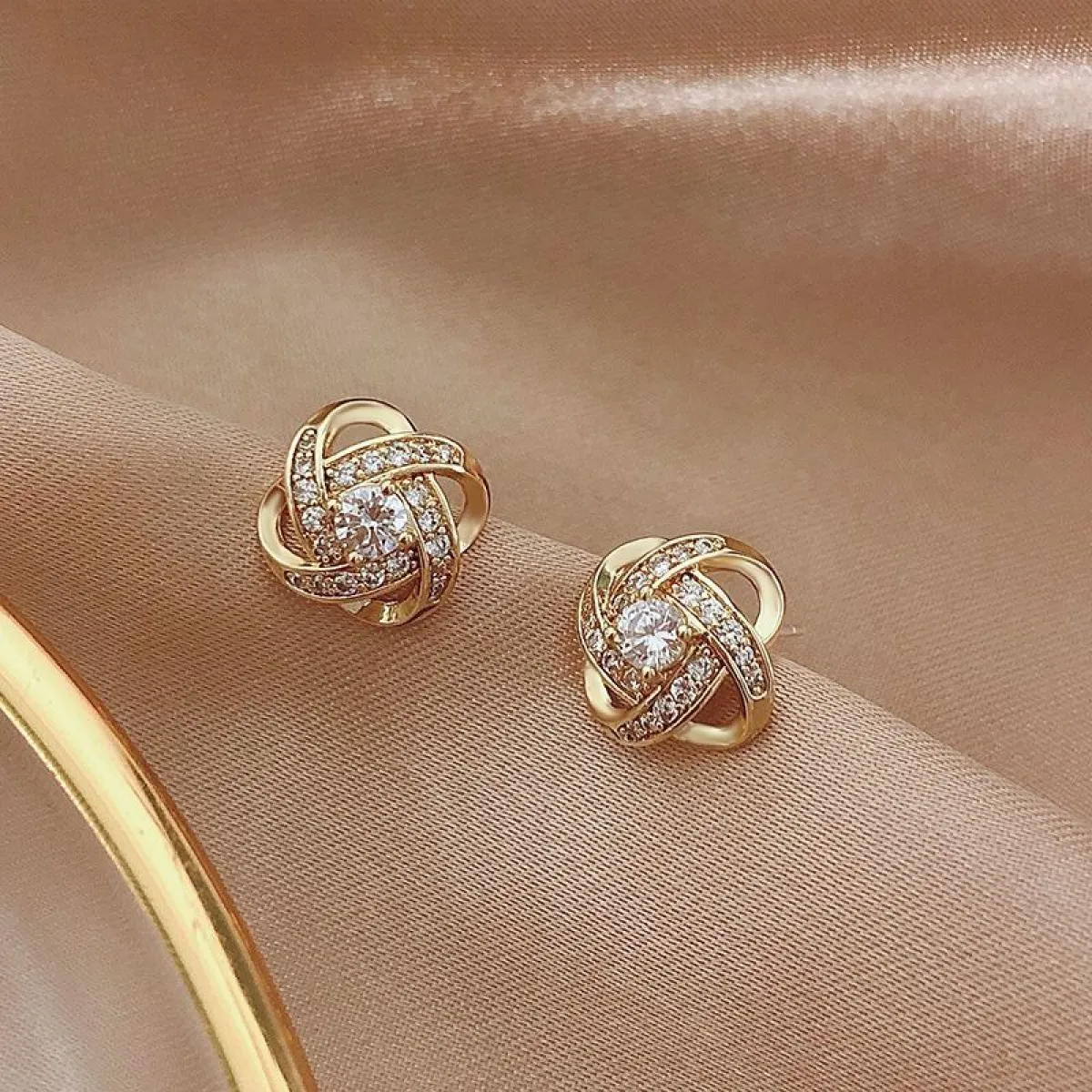 Women’s Cross Ear Studs Showcasing Geometric Hollow Design and Stone Embellishments